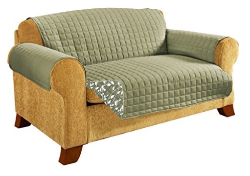 A two seater sofa with a plush quilted sofa protector in khaki and nice pattern design